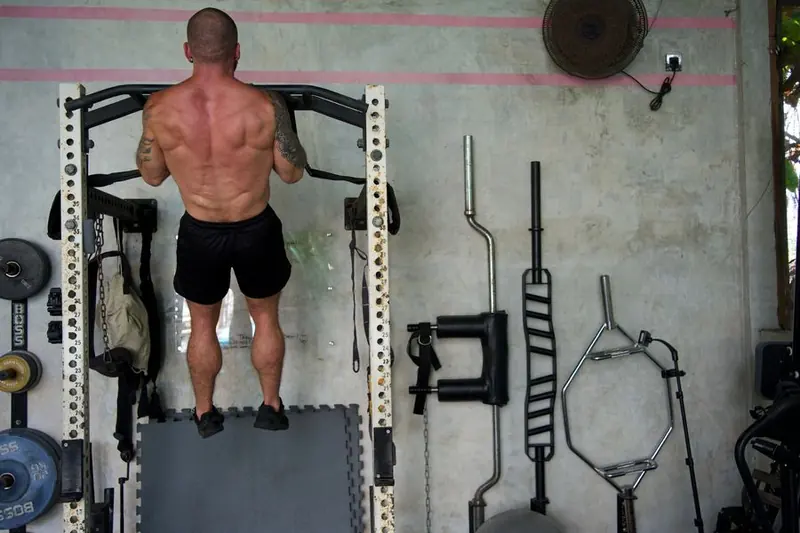 Coach Boltz mid rep on weighted pull-ups